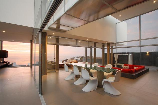 stunning-ultramodern-beach-house-with-glass-walls-10-open-panel-door.jpg